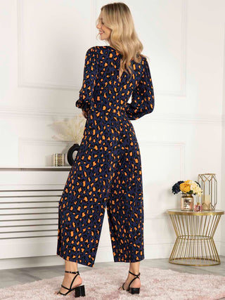 Kylie Long Sleeve Jumpsuit, Animal Multi, Front Knot Detail, Puff Sleeves, Cuffed Sleeves, V-neckline, Wide Leg, 2 Side Pockets, Mini Open Back, Back Side